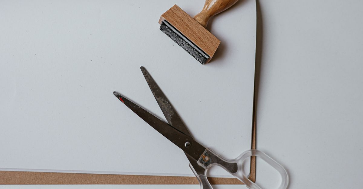 Brown Wooden Stamps and Scissors on the Table · Free Stock Photo