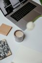 White Ceramic Mug Beside Macbook Pro