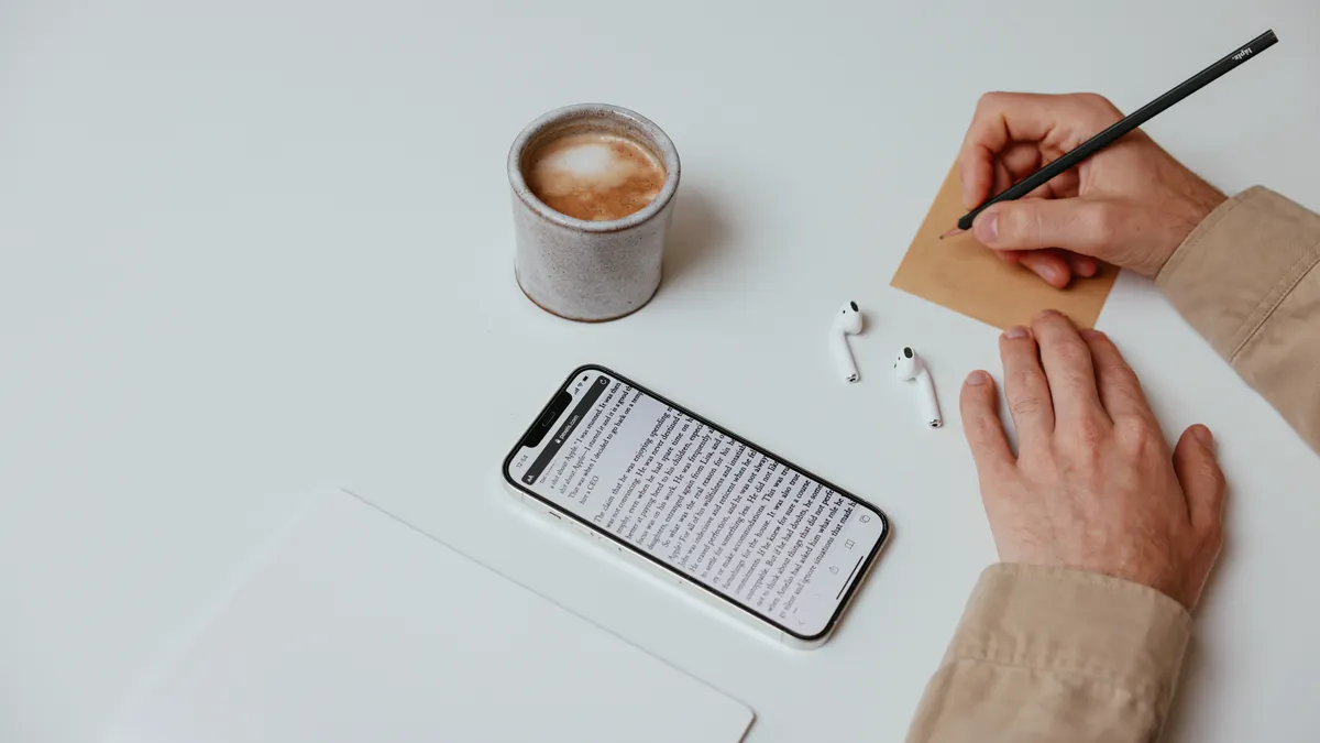 Anyword vs Jasper for ad copy Anyword vs Jasper for ad copy — Person Writing a Note on White Table