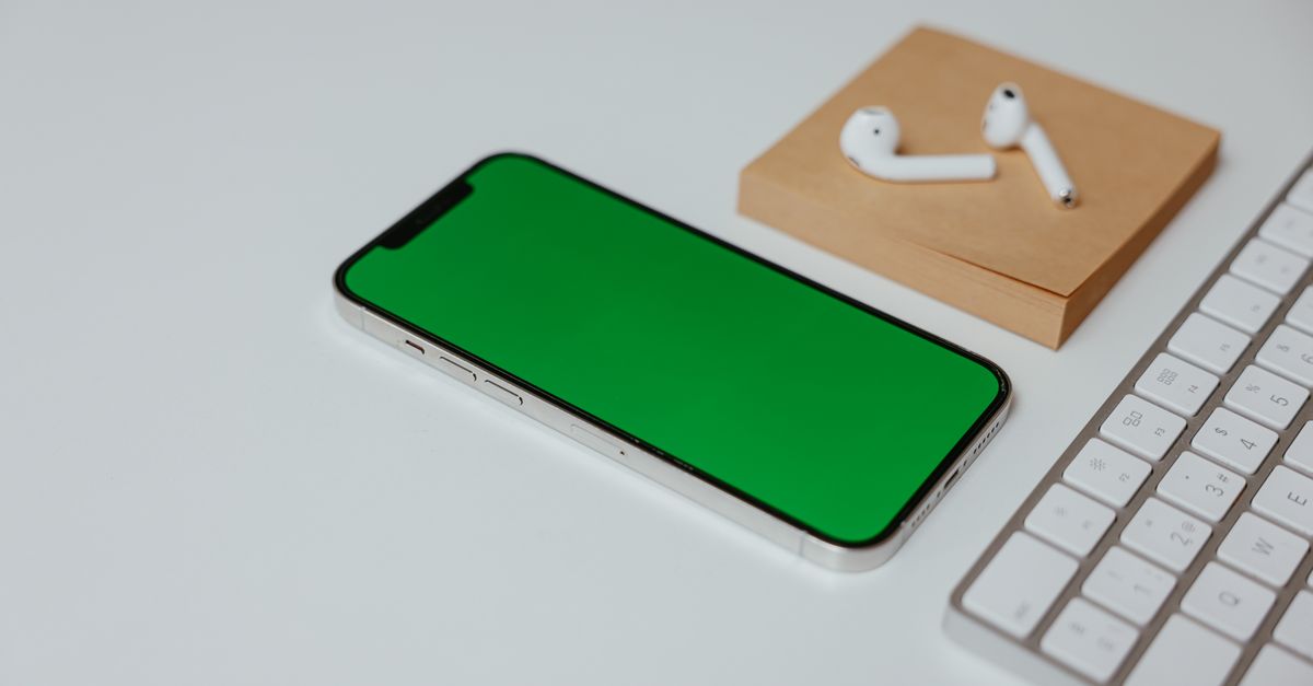 wireless earphones and smartphone on desk