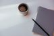 A notebook and pencil beside a cup — photo by Cup of Couple on Pexels