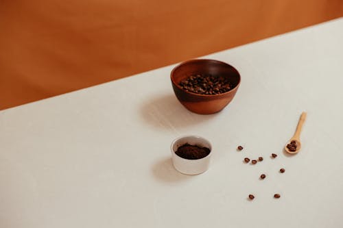 Bowls of Coffee Beans on a White Table