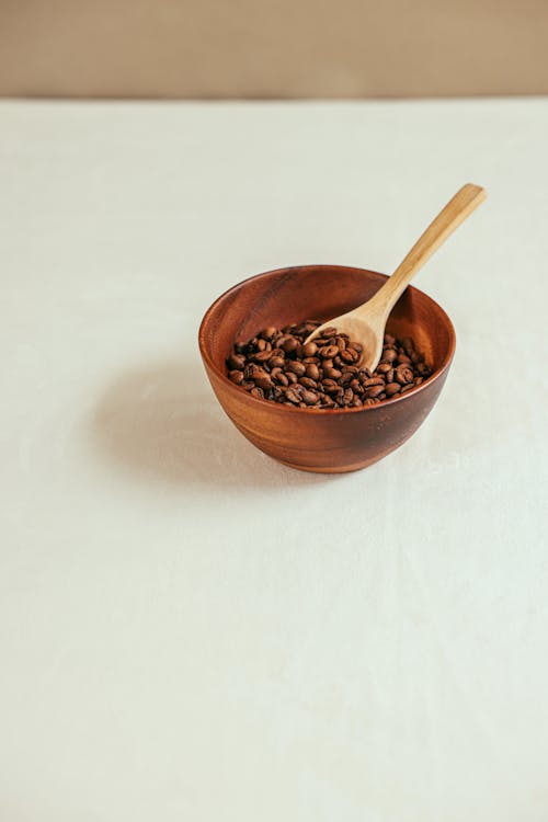 A Coffee Beans in the Wooden Bowl