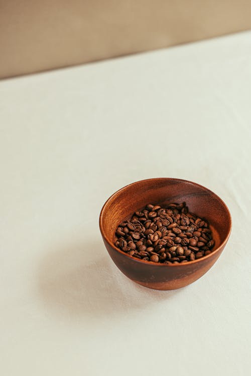 Free A Brown Coffee Beans on a Wooden Bowl Stock Photo