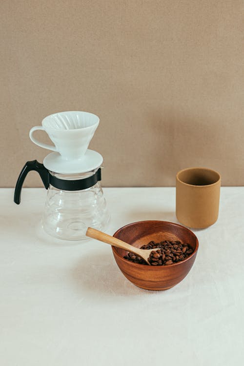 A Bowl of Coffee Beans beside a Pour Over Set