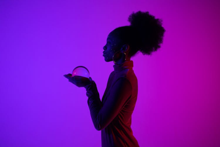 Woman Holding A Crystal Ball