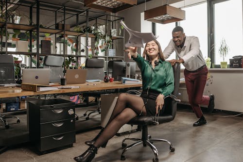 Man and Woman Having Fun in Office