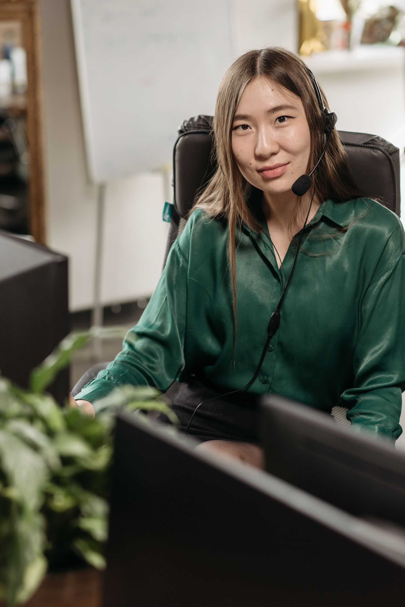 Professional interpreter wearing a headset during a remote phone interpreting session