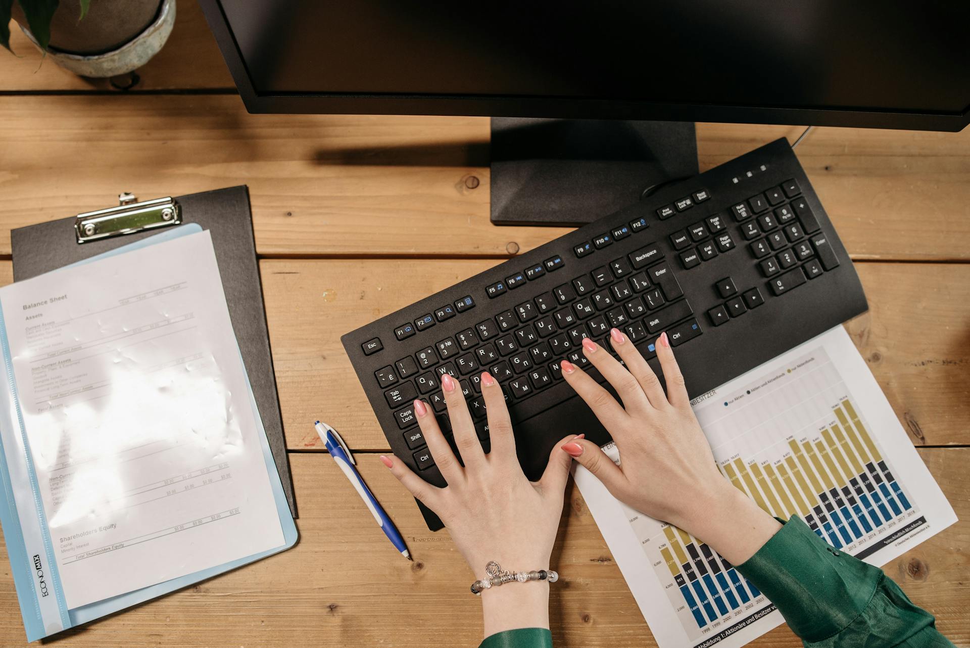 Person Typing on Black Computer Keyboard