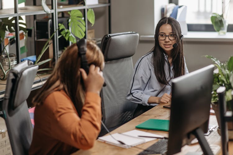 Two Women Working In The Office 