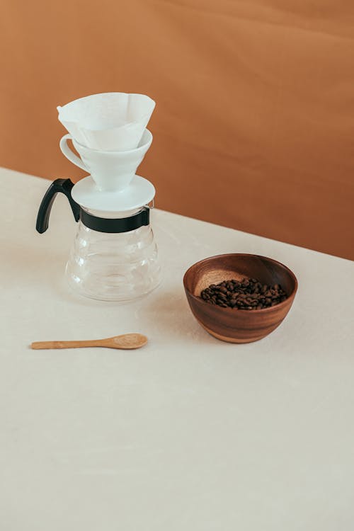 A Bowl of Coffee Beans and a Drip Coffee Maker
