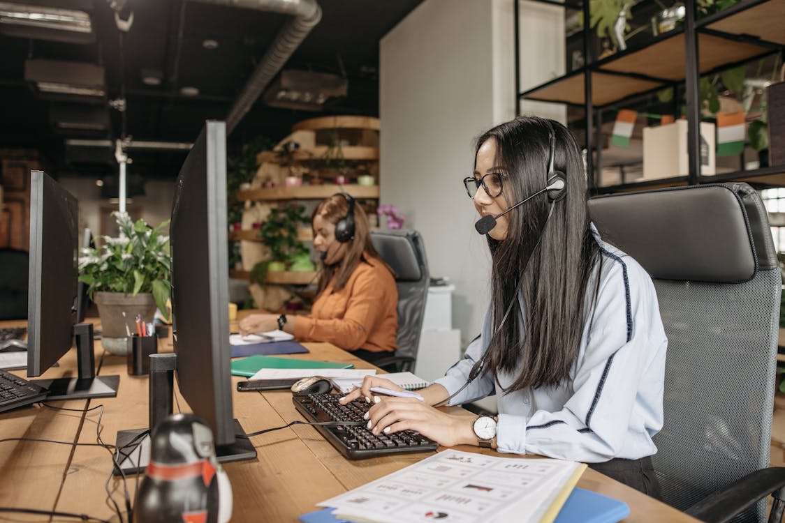 Free Women Working in the Office Stock Photo