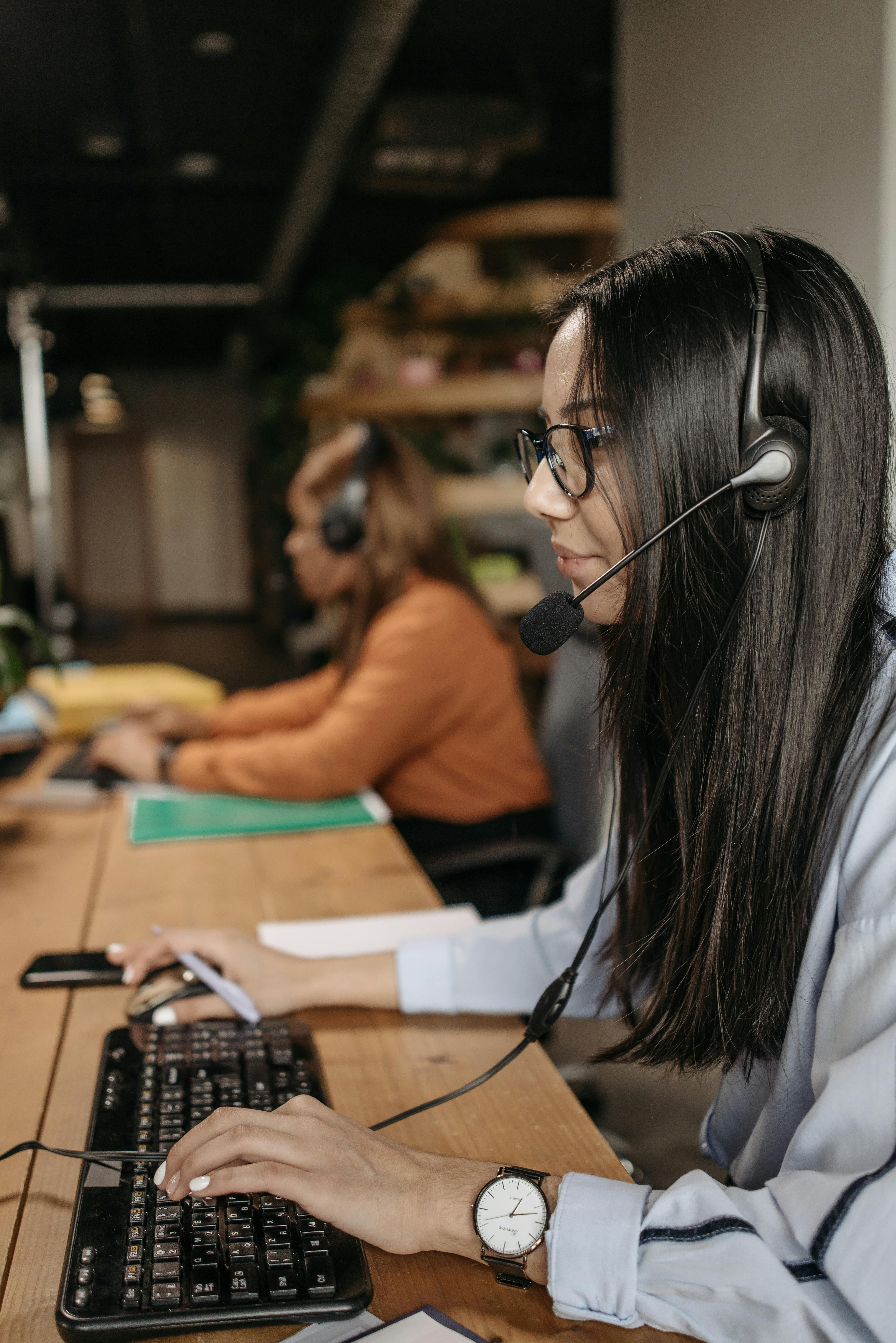 Two people collaborating using VR headsets in a modern office