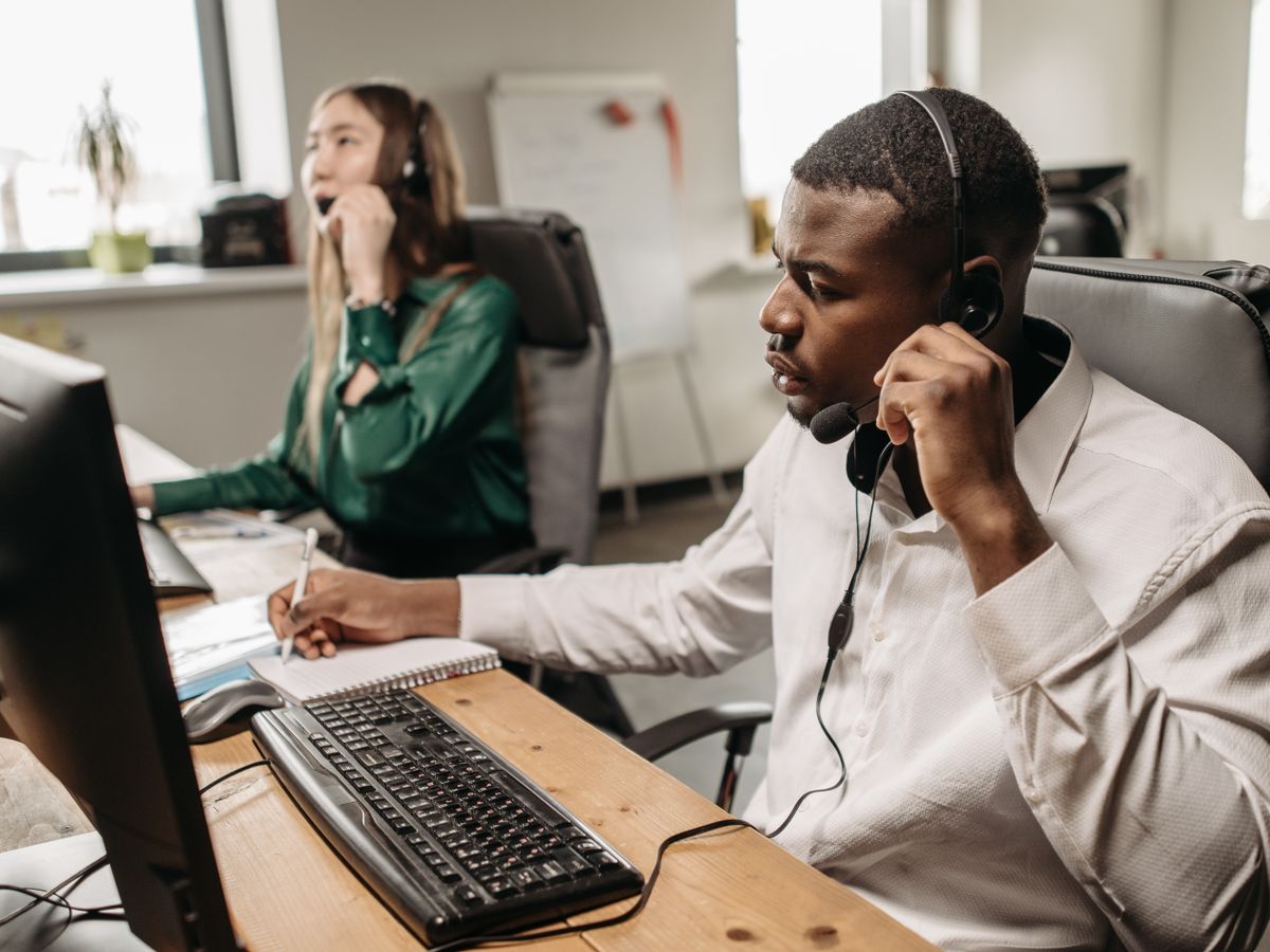 Support team taking calls at their desks