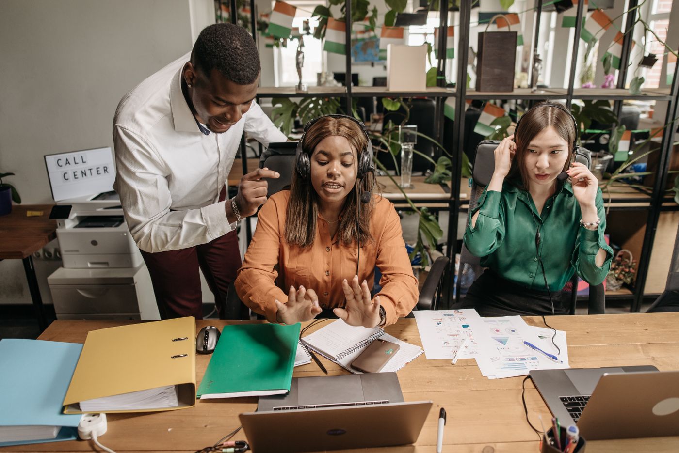 Call center employees collaborating in a modern office