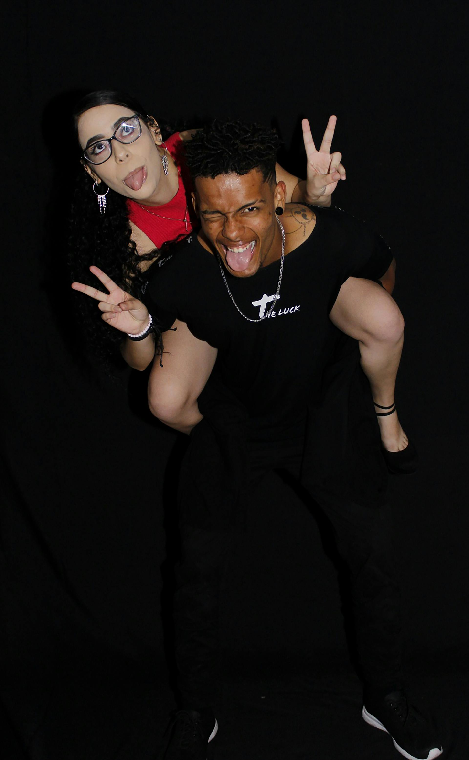 Raised garden beds beneath railway arch with community murals