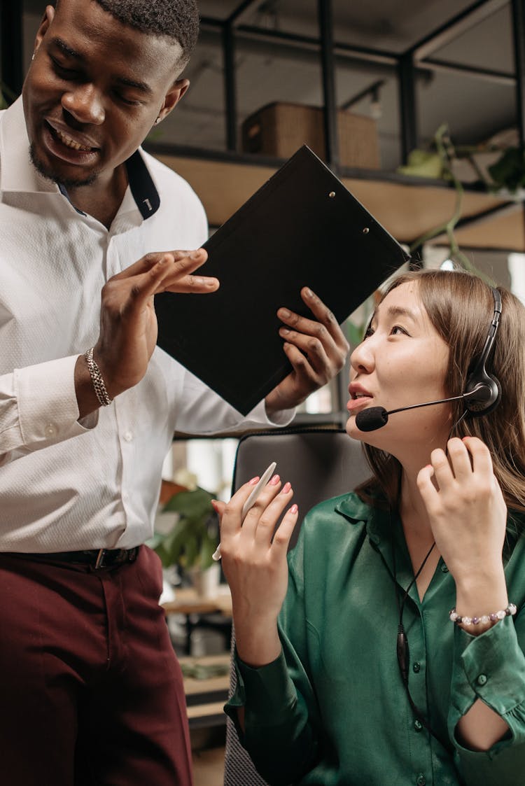 Colleagues Having A Conversation At Work