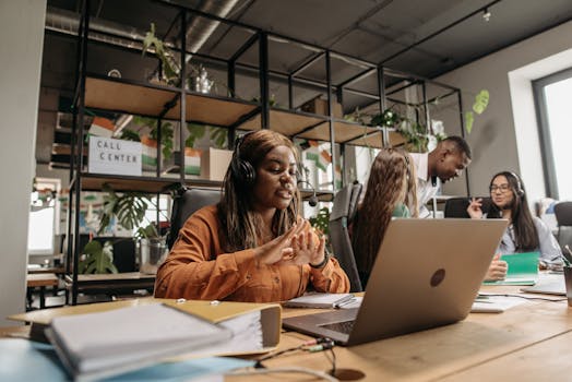Diverse call center team working collaboratively in a modern office environment.