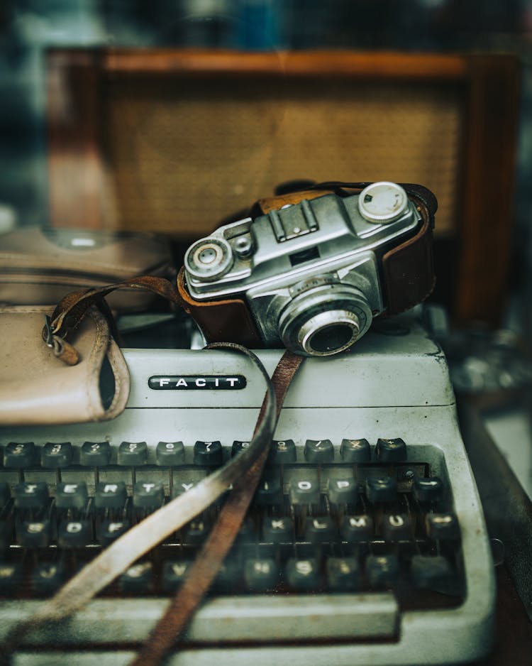 Close Up Of Typewriter And Camera