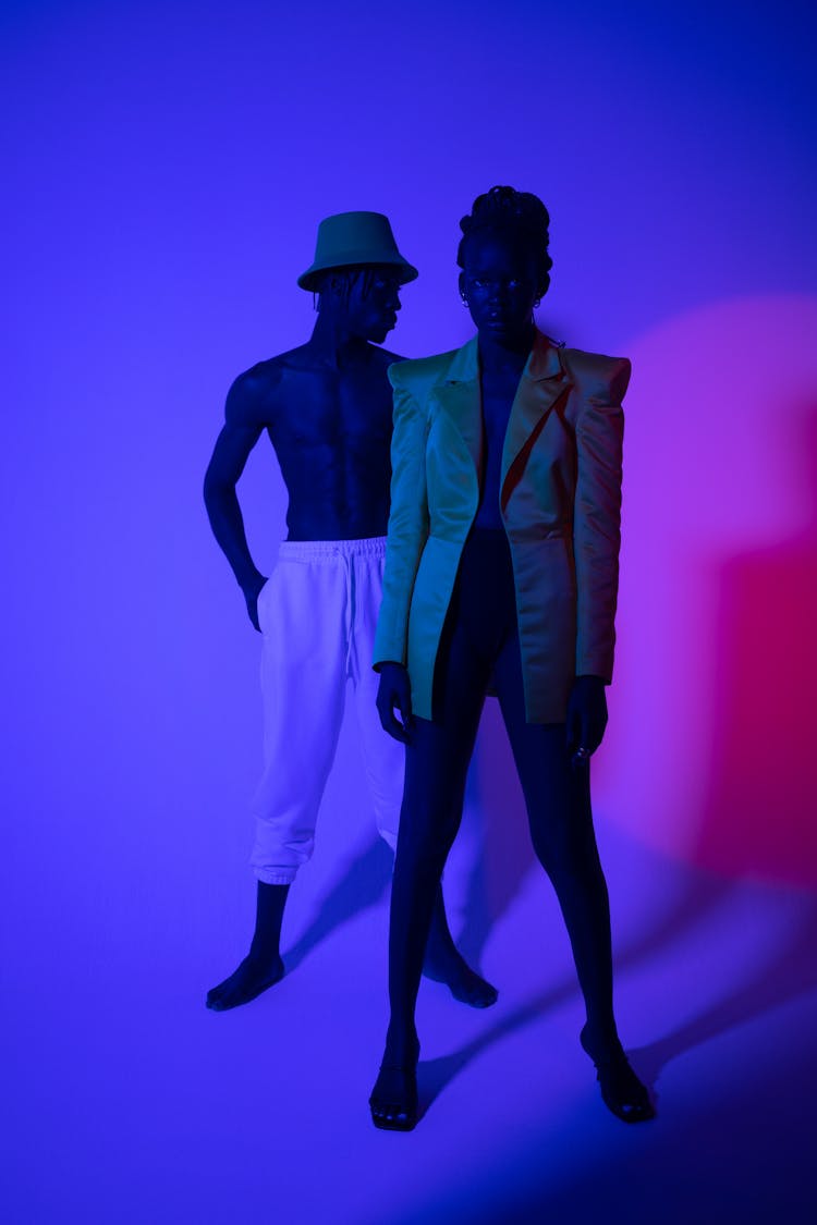 A Man And A Woman Posing On The Studio