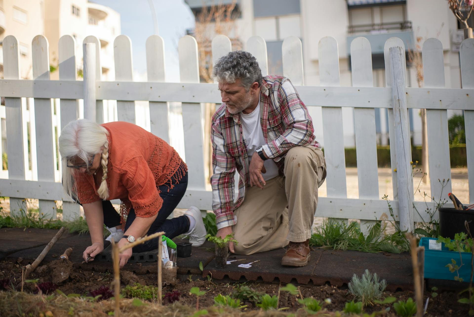 Man and Woman Digging a Dirt Ground