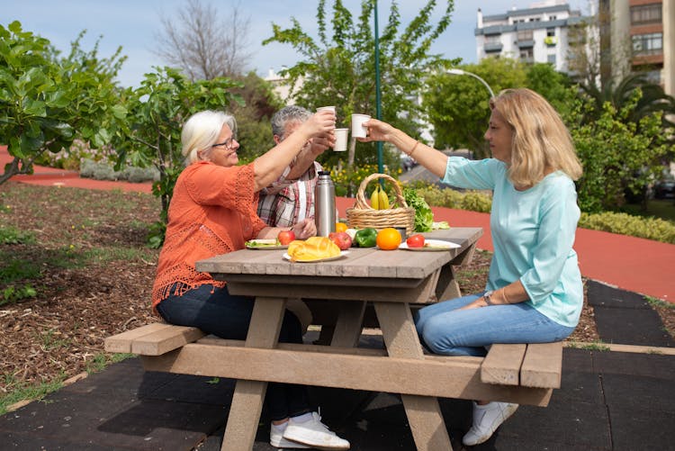 People Toasting A Drink