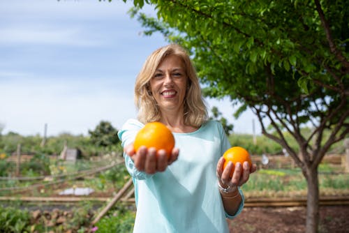 A Woman Holding Oranges