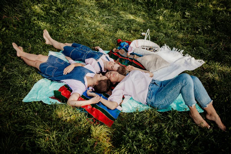 Women Lying Down On Picnic