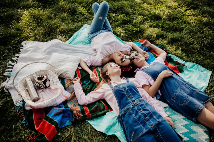 Women Lying Down Together On Picnic