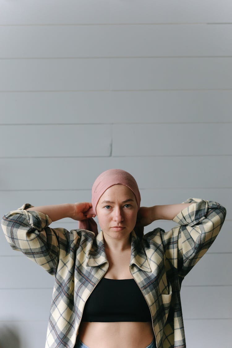 Woman Tying Her Pink Headwrap