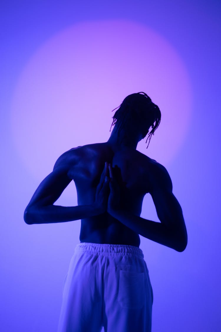 A Shirtless Man In Reverse Yoga Pose