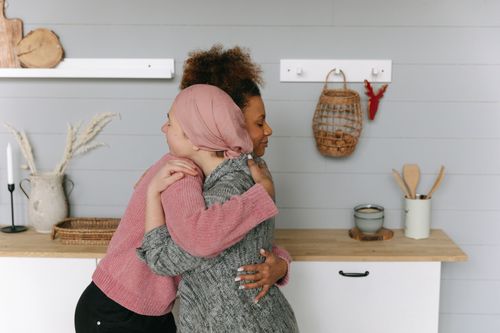 Free A touching moment of friendship and support captured indoors. Stock Photo