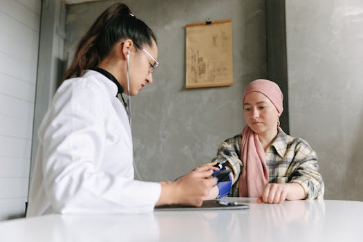 A medical professional checks a patient's blood pressure, depicting a caring healthcare environment.