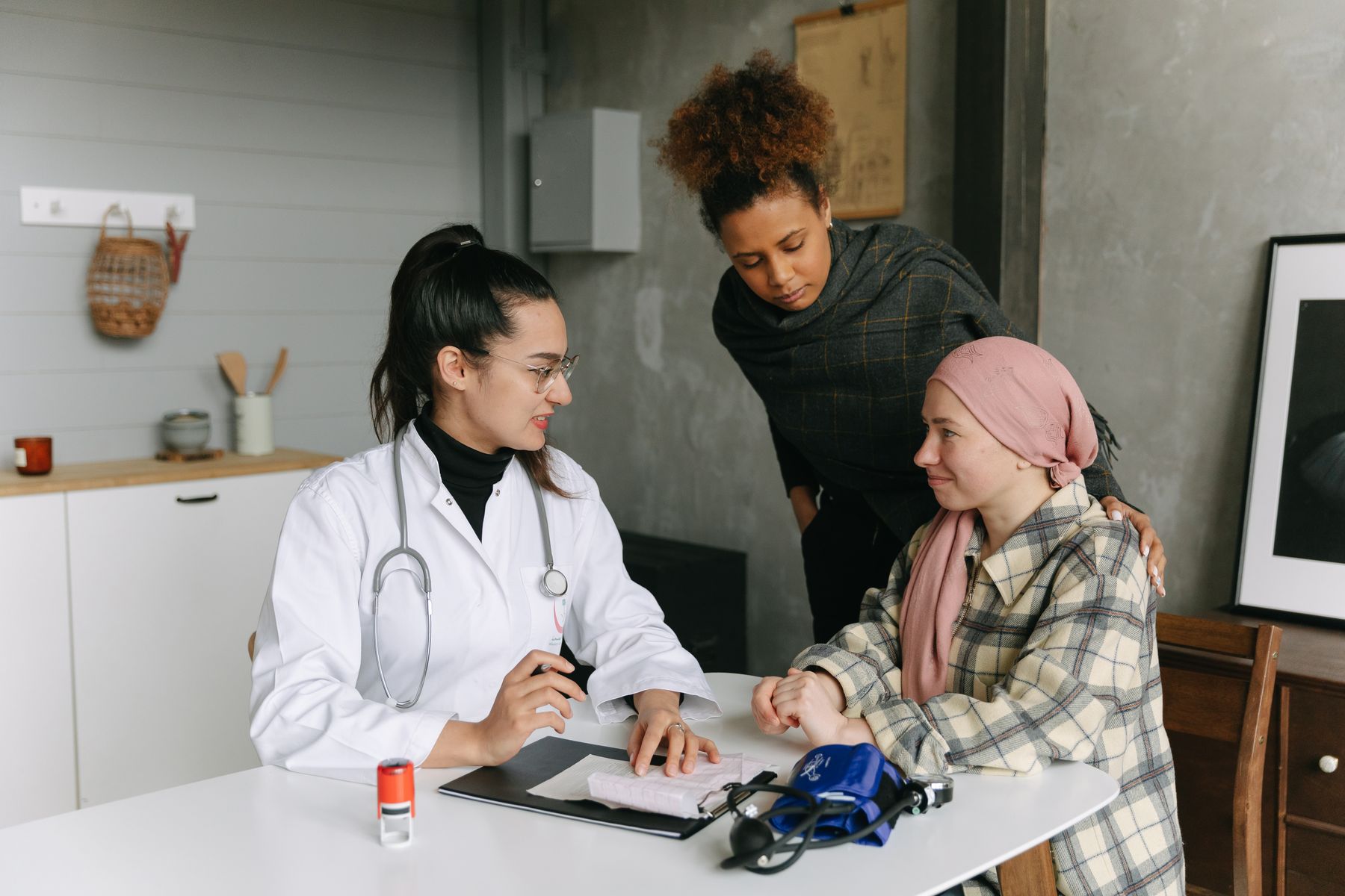 Nurse helping a patient recover at home after surgery