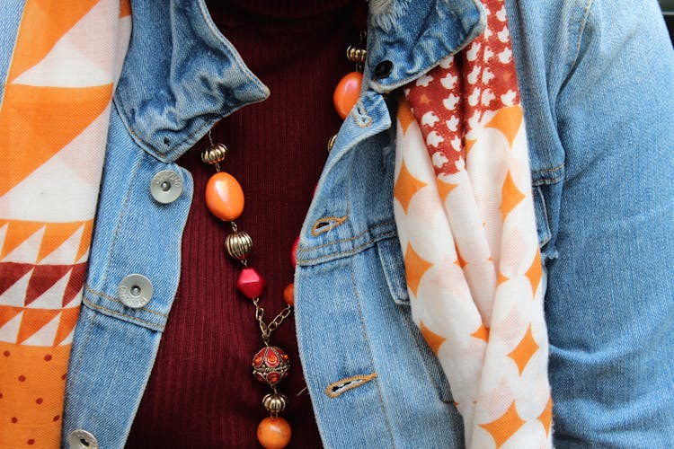 Close Up Of Necklace And Scarf On Clothes