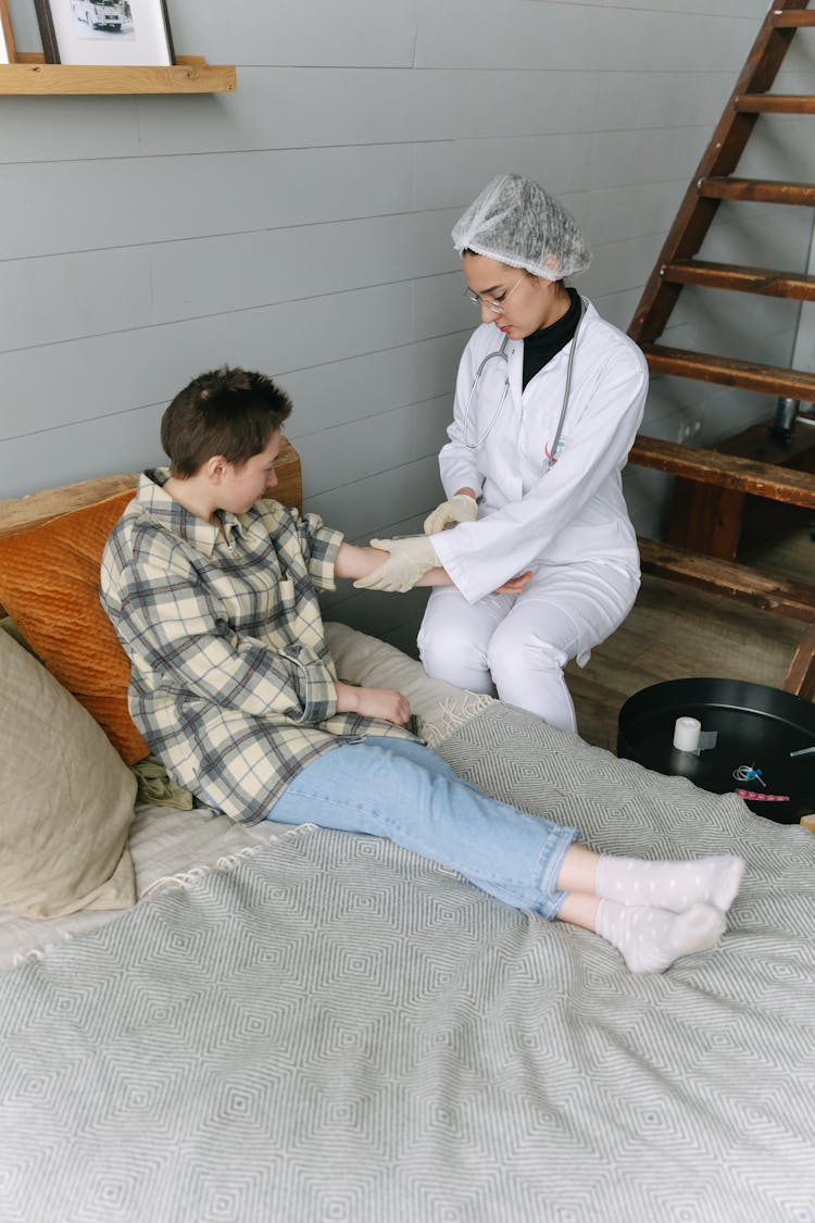 A Doctor Holding A Patient's Arm