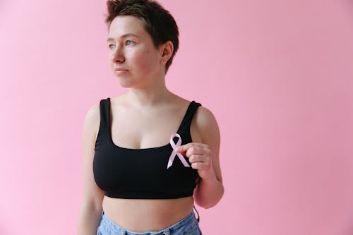 A Woman Holding a Pink Ribbon 