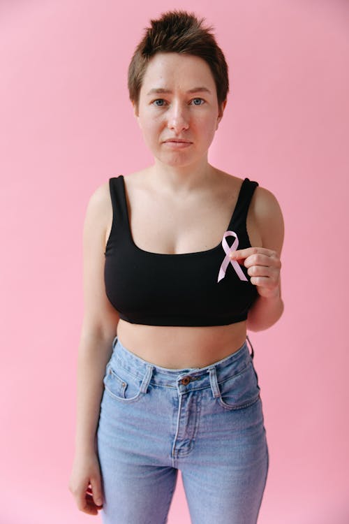 A Woman Holding a Pink Ribbon
