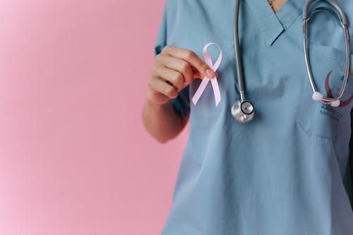 Free A Medical Professional Holding a Pink Ribbon Stock Photo