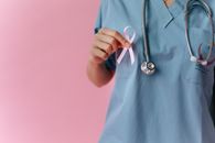 Person in Blue Scrub Shirt With Stethoscope