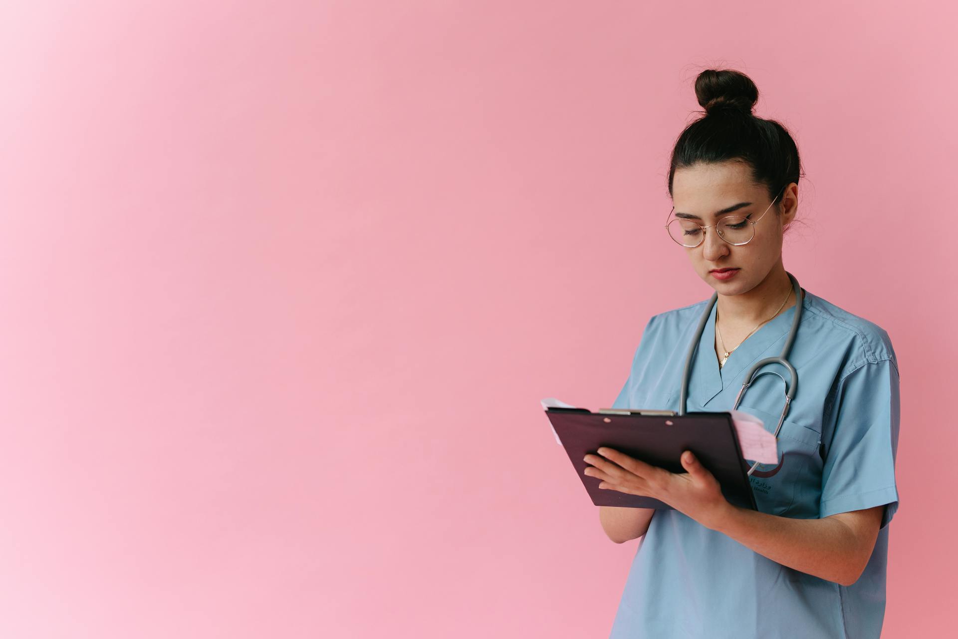 A Healthcare Professional Looking at a Clipboard