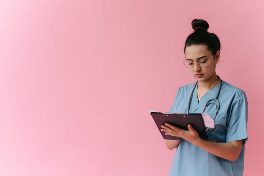 Healthcare professional reviewing clinical notes