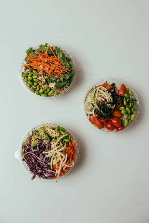 Free Discover these vibrant salad bowls with fresh vegetables like edamame and carrots for a healthy diet. Stock Photo