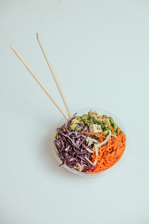 Bowl of Vegetable Slice with Chopsticks