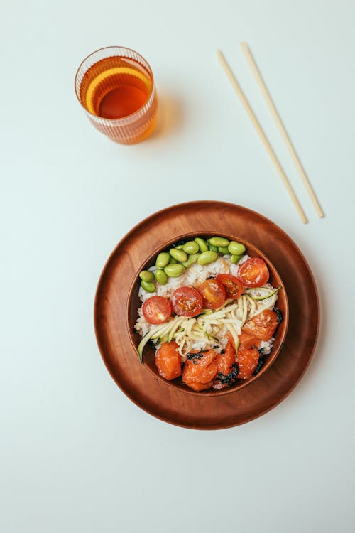 Rice Bowl Beside a Cup of Tea