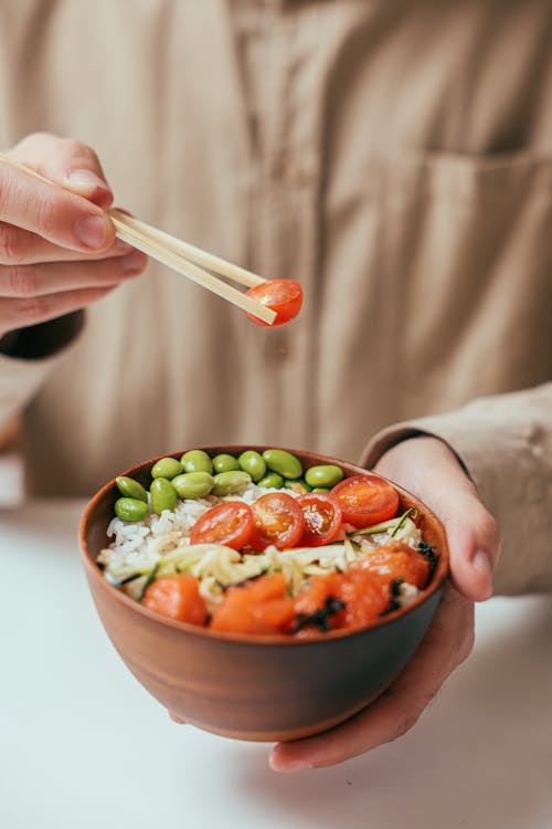 Free Person Eating a Rice Bowl Stock Photo