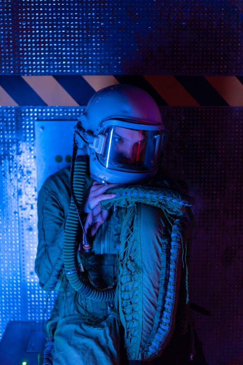 Woman In Spacesuit With Reflection Of Blue Light 