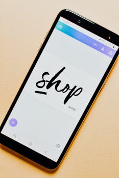 Close-up of a smartphone screen with a 'Shop' application interface on a light background.