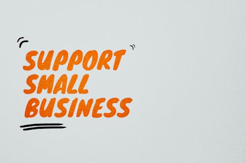 Free Support Small Business Text on a White Surface Stock Photo