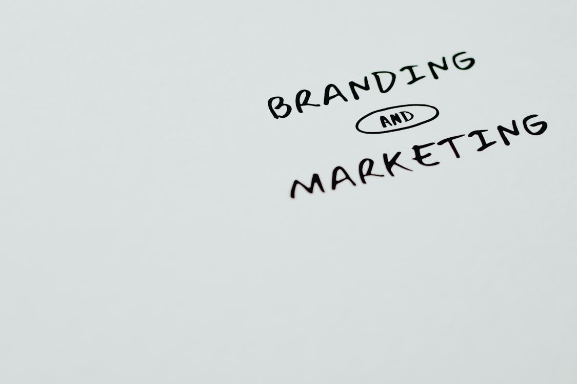 Free Branding and Marketing Text on a White Surface Stock Photo
